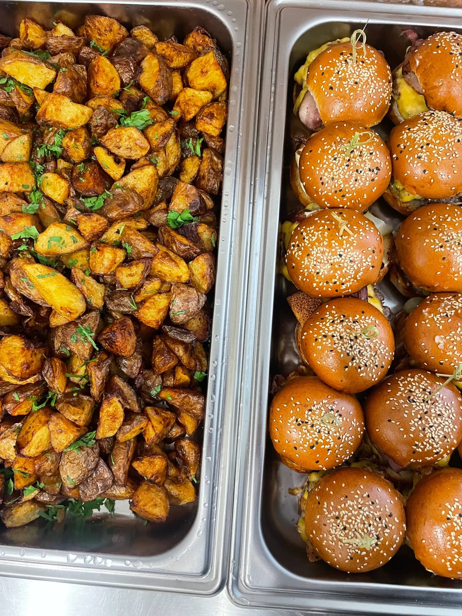 Miniburgers and baked potatoes on catering.